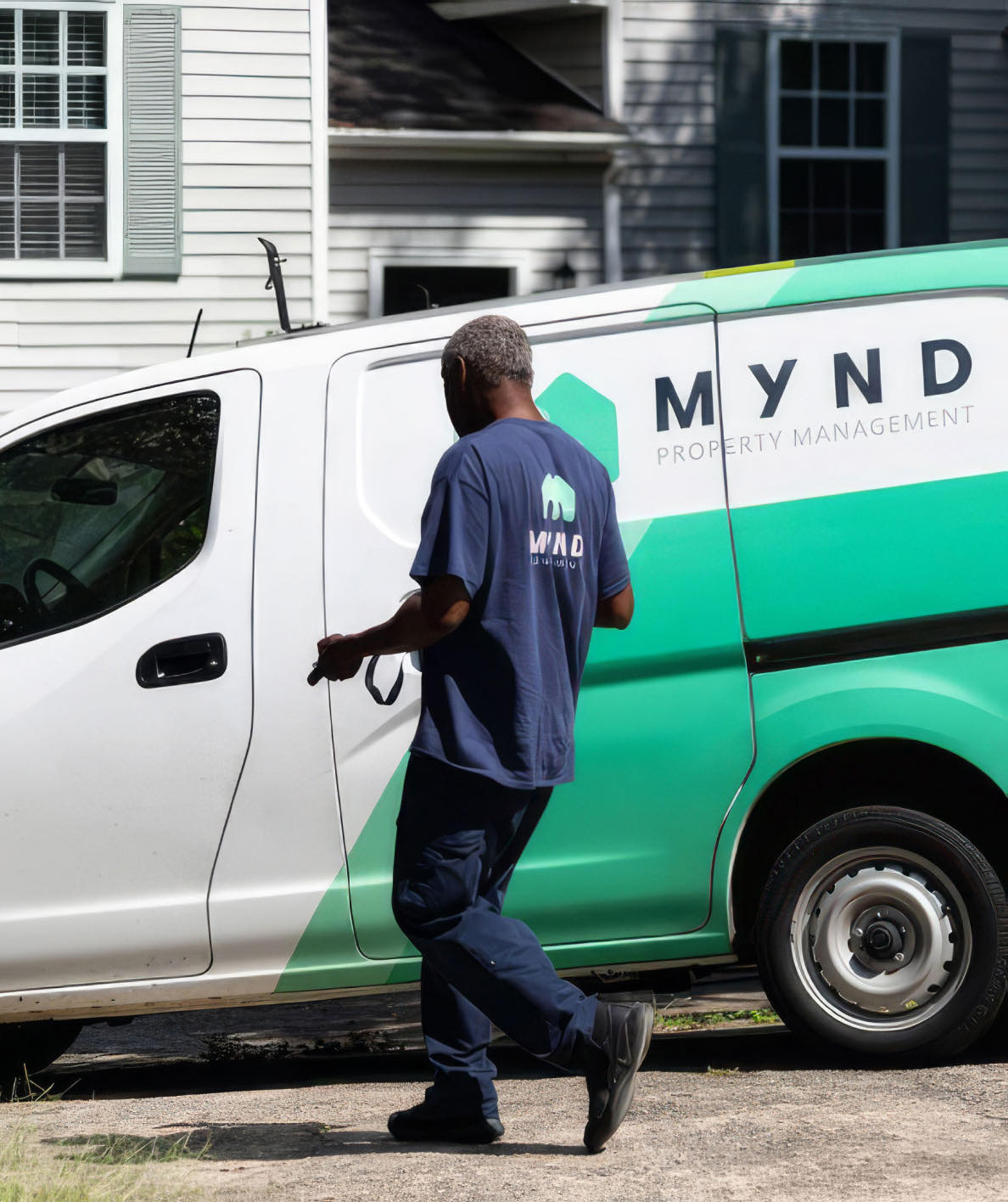 Mynd property manager beside a Mynd branded van